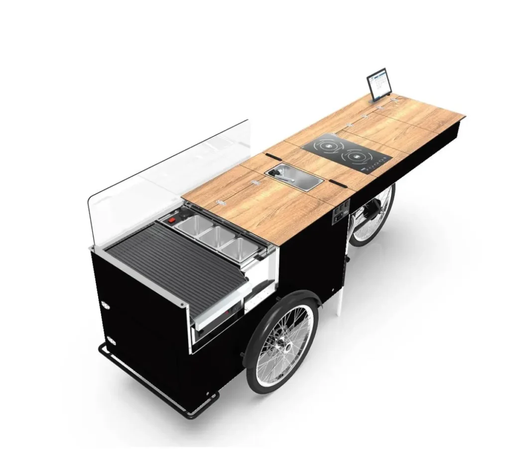 Single cooker cooking cart next to double stove build